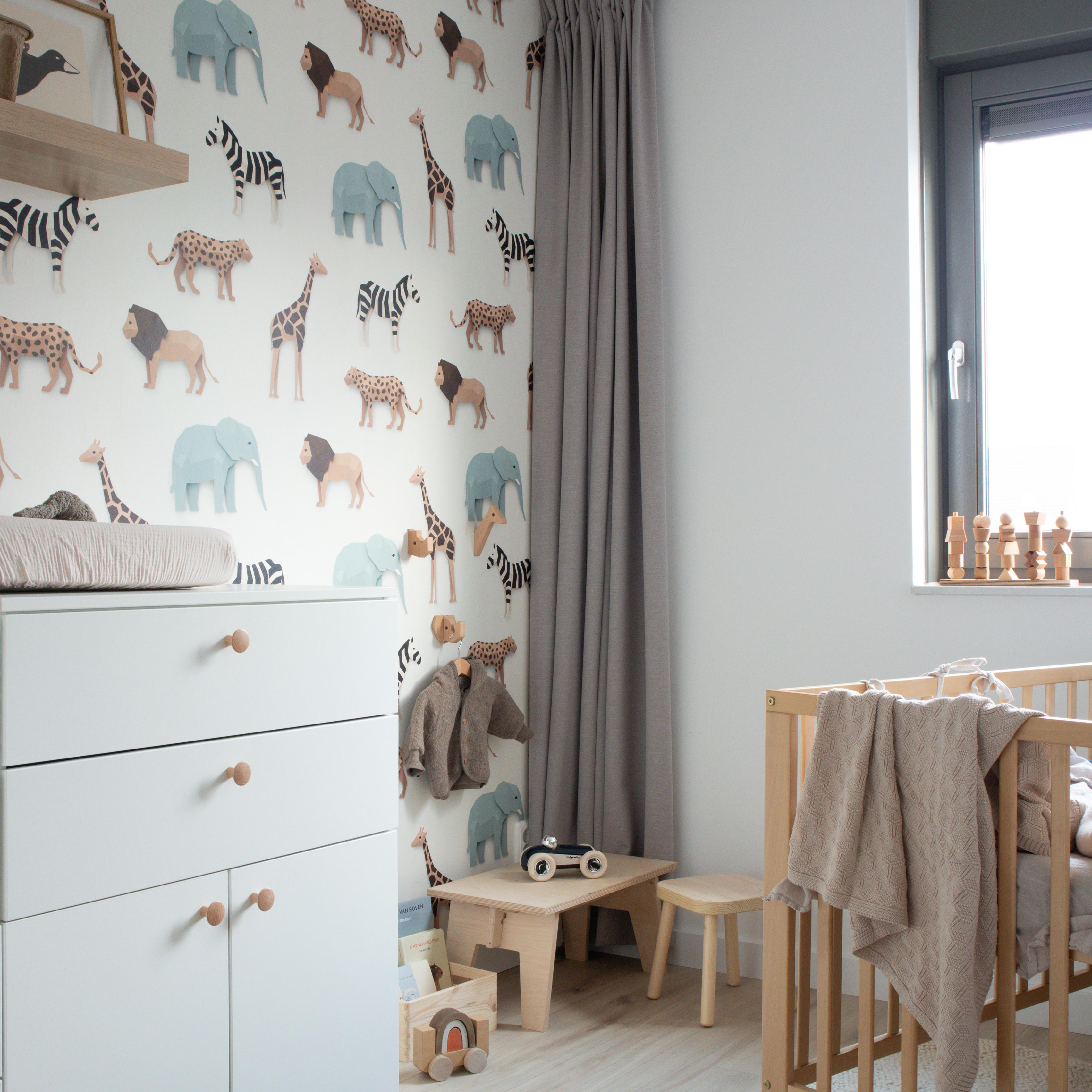 Nursery with safari wallpaper
